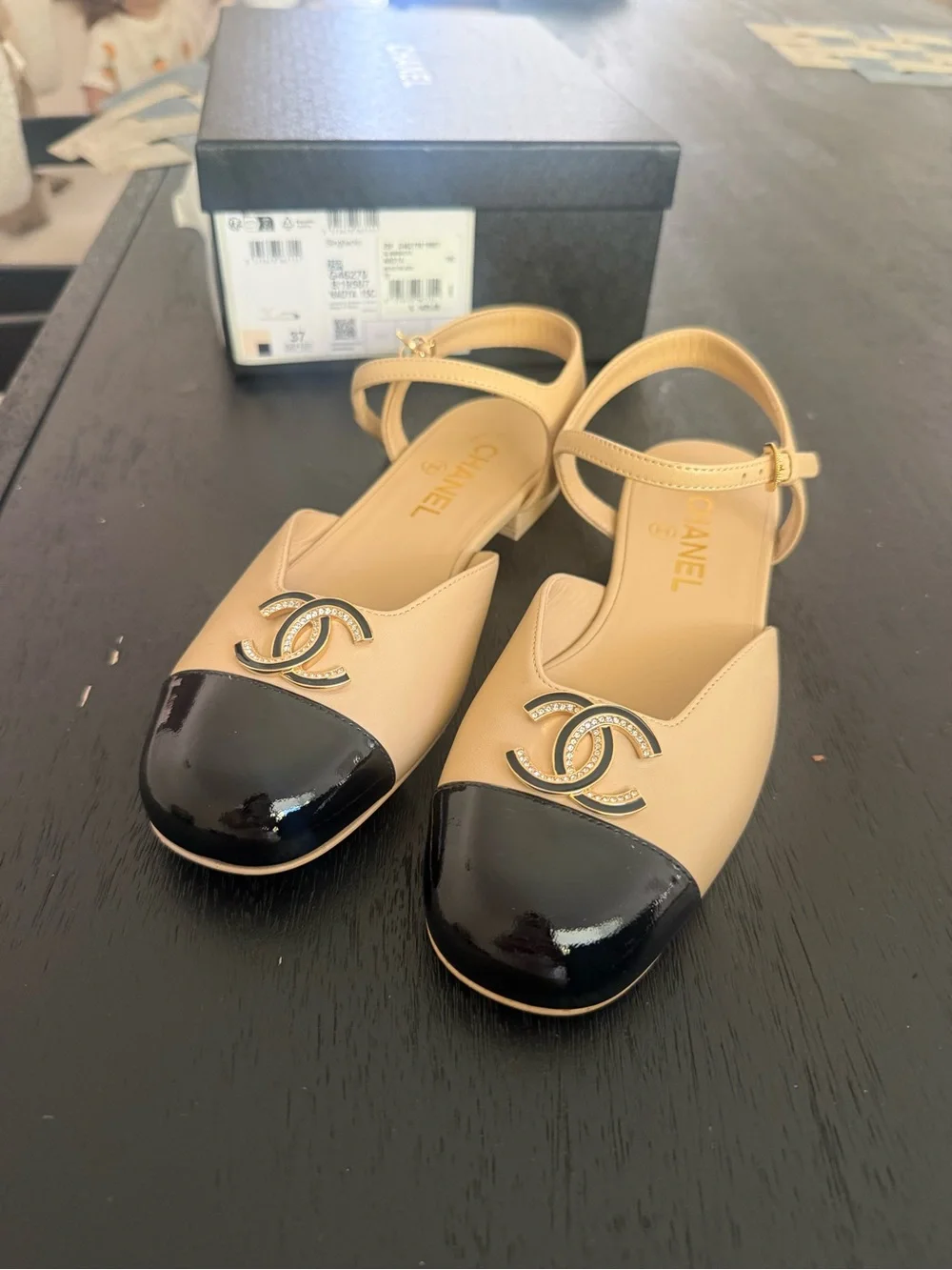 CHANEL Beige and Black Cap-Toe Logo Slingback Flats